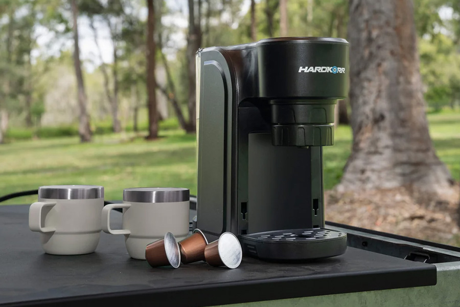 Picture of Hard Korr Coffee Pod Machine on  a table outdoors